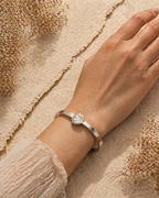 MM Jewelry: Sleek Silver Bangle with Mother-of-Pearl Centerpiece